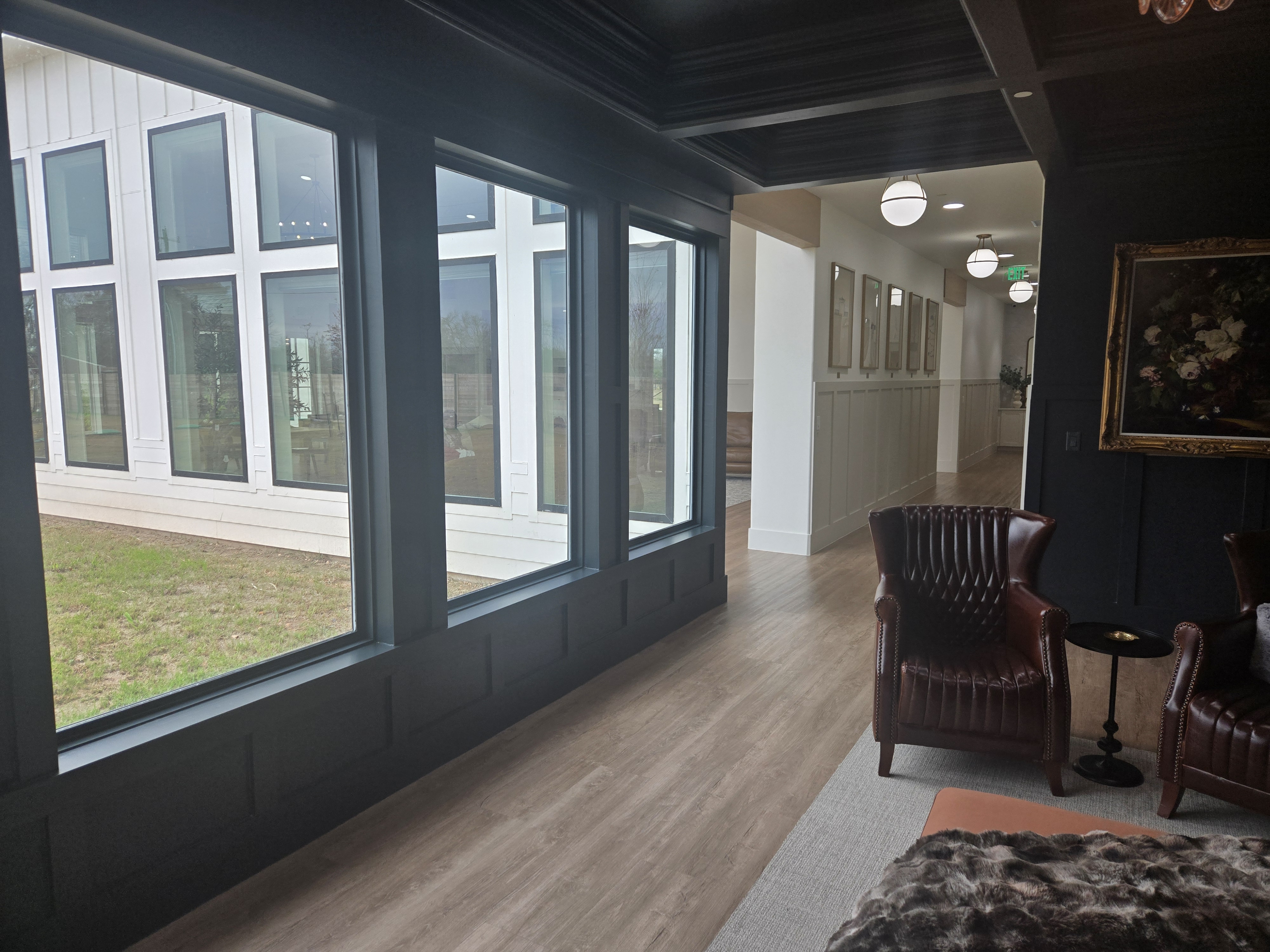 Common sitting room with large windows